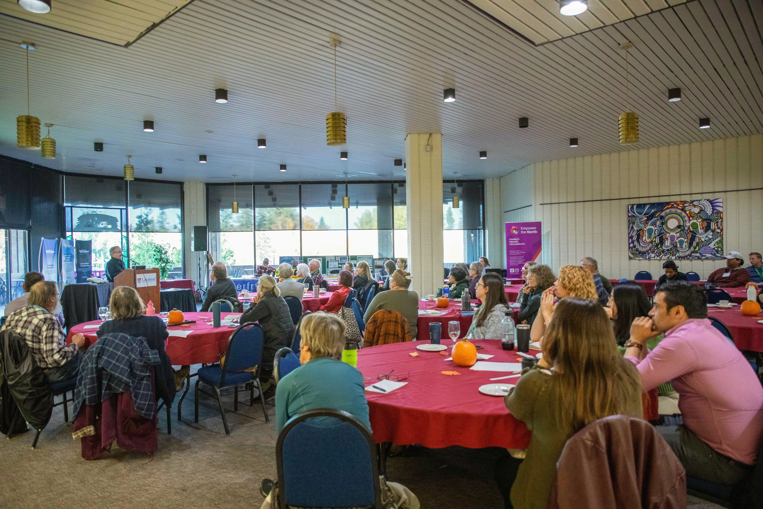 Lloyd Alter, keynote speaker, addressing a room full of listeners at the 3rd Annual Northwest Climate Gathering, Oct 18, 2026, Thunder Bay, Ontario.